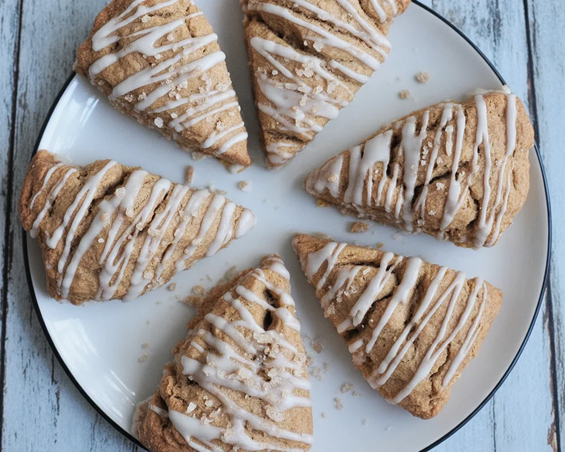 Delicious mouthwatering pumpkin cinnamon scones topped with a cinnamon brown sugar glaze.