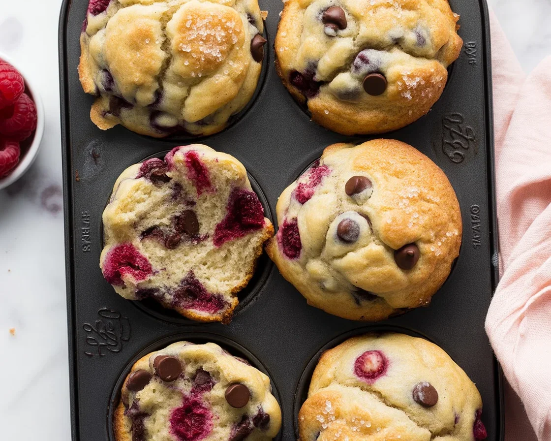 Homemade Raspberry and Chocolate Chip Muffins with fresh raspberries and chocolate chunks